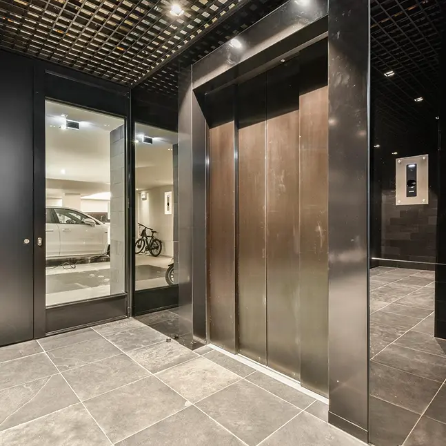 Elevator cabin door finishes and interior detailing