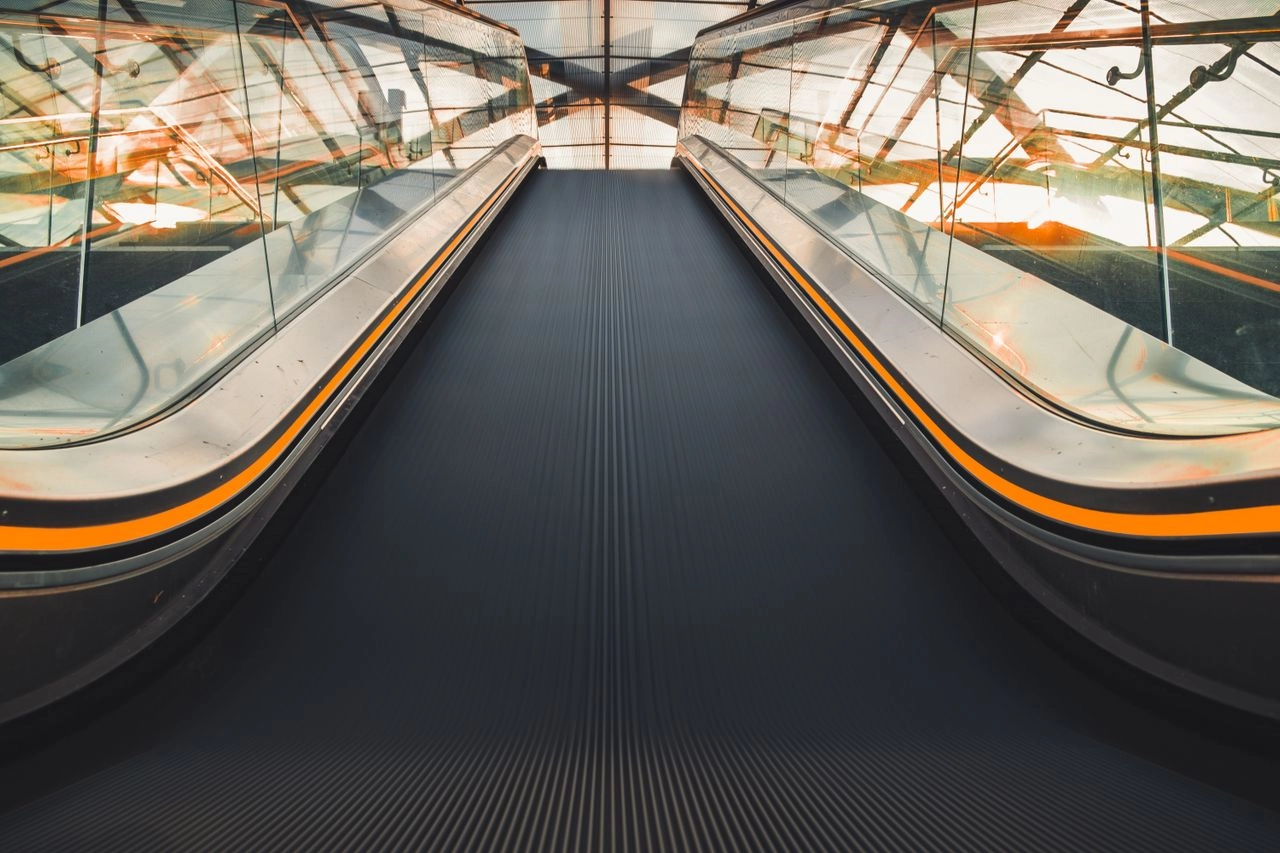 Inclined moving walkways